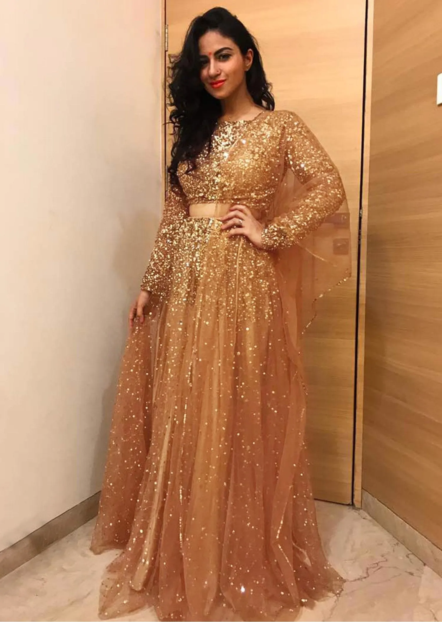 Gold lehenga embellished in sequin embroidery